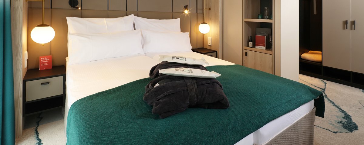 Inside view of the cabins in category F on the A-ROSA SENA with balcony.